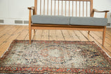 Lower right corner view, showing heavy wear and tattered brick red border of the vintage Dargezine rug.