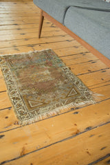 Vintage Oushak rug mat showing visible foundation and hard tatter to ends.