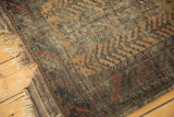 Tattered fringe, worn pile with visible knot heads, and barber pole border.