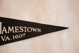 Felt texture and cream lettering on the pointed tip of a vintage Jamestown pennant.