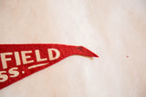 Red felt pennant's pointed tip with white 'FIELD SS.' lettering and dark stain.