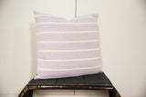 Textured hand-woven lavender pillow featuring distinct ivory stripes.