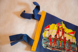 Blue felt ties and yellow binding on a vintage Cypress Gardens pennant.