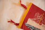 Vintage red felt flag corner with yellow binding and two red ties.