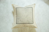 Bedford NY map pillow, featuring the map print's bottom right corner and natural fabric.