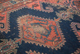 Antique Fine Malayer rug's navy field with faded brick red diamond and intricate rams horn motifs.