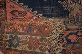 Hard tatter and exposed foundation at the fringed end of the antique Malayer rug.