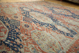 Antique Caucasian Soumac flatweave with geometric patterns in navy, madder, and textural wear.