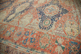 Antique Soumac carpet showcasing madder root red, navy geometric motifs and visible wear.