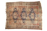 Antique Caucasian Soumac carpet, triple dark blue medallions, red-ivory field with visible foundation.