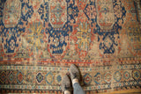 Intricate geometric patterns and vinery in madder red, indigo, gold, foundation showing.