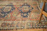 Antique Caucasian Soumac with geometric starbursts, vinery, and foundation wear.