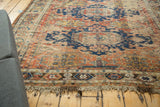 Antique Caucasian Soumac geometric border in madder red and charcoal, showing original fringe.