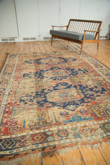 Light tatter visible on the fringe and side cord selvage of the antique Soumac rug.