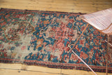 Antique Karabagh Soumac rug with vivid blue field, floral interpretations, exposed foundation, wave border.