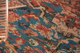 Antique Karabagh Soumac rug's intricate flatweave texture with mallard green and dusty rose patterns.