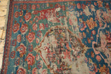 Antique Karabagh Soumac rug with faded asymmetric medallion, cloud band, roses, and foxes.
