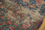 Karabagh Soumac rug detail showing visible foundation among mallard green and cherry red florals.