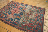 Antique Karabagh Soumac rug with extensive pile wear, exposed foundation, and tattered side.