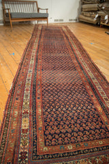 Antique Kurdish Malayer runner with intricate indigo field, madder red boteh and striped borders.