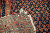 Antique Kurdish Malayer runner with tattered fringe, hand-knotted reverse, and indigo, red, gold boteh pattern.
