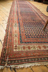Antique Kurdish Malayer runner with madder root red borders and tattered fringe.