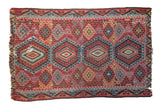 Antique Turkish Kilim carpet, quadruple cherry red, blue, gold geometric medallions, with aged character.