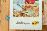 Classic Kodak film slogan and yellow box logo on the vintage ad's aged paper.