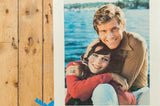 Close-up of the smiling couple on the vintage Kodak print, showing surface speckling from age.