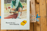 Close-up of the vintage Kodak print's slogan, logo, and age-related speckling on the border.