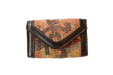 Vintage Kilim rug fragment wallet with geometric pattern, peach, brown, and dark faux leather.