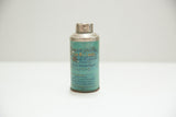 Full front view of antique tooth powder tin, faded teal label and text.