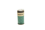 Green vintage Albodon Dental Tin with white polka dots and beige text label.