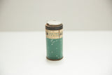 Vintage Albodon dental tin with teal body, 'FOR THE TEETH' text, and aged metallic lid.