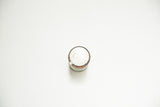 Vintage Albodon Dental Tin, aged white top with marks and tarnished metallic body.