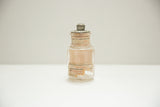 Antique glass Colgate dental powder jar with its original embossed metal lid.
