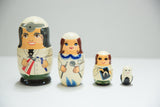 Smaller hand-painted Russian dolls, including a child dentist with an X-ray and a tooth.