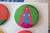 Vibrant green Beatles Yellow Submarine pin with striped character, showing surface scratches.