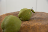 Textured green vintage Mexican folk art clay chayote piggy bank with wire stem.