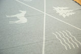Katonah NY blanket woven texture, with light gray deer and tree patterns.