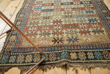 Antique Caucasian rug end, madder red and sky blue starburst bands, tribal border, light tatter.