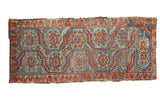 Antique hand-knotted Persian Heriz fragment with sky blue field, madder red serrated leaves, floral designs.