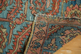 Hand-knotted blue, red Heriz rug pile with serrated leaves and tight, professionally seamed reverse.