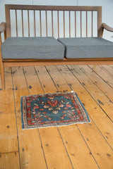 Vintage Lilihan mat, circa 1930s, with indigo field and cranberry floral palmette.