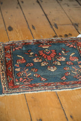 Vintage Lilihan rug with central floral palmette, pedestal vase, and budding vines.