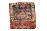 Antique hand-knotted Kurdish square rug, indigo blue, madder red rams horn motifs, patterned border.