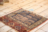 Madder root red barber pole zig-zag border, indigo rams horn motifs, and tattered fringe.
