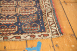 Antique Kurdish rug border detail with barber pole design, indigo field, and light edge tatter.