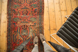 Vintage Lilihan rug fragment displaying Gerus arabesques in raspberry red, sky blue, and mallard green.