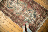 Vintage Hamadan rug, faded triple medallion, exposed foundation, oxidized red and blue.